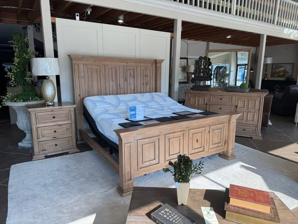 A staged bedroom set on the Willis Furniture showroom floor in Pascagoula